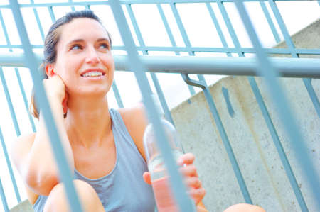 Mature woman working out in an urban setting, from a complete set of photos.