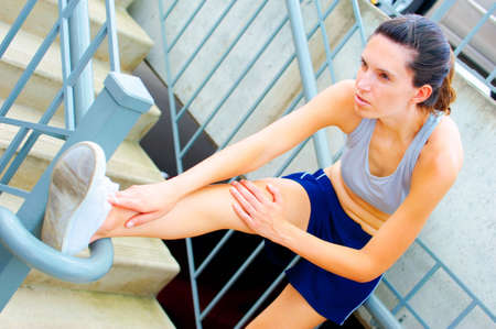 Mature woman working out in an urban setting, from a complete set of photos.