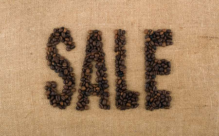 The word SALE from coffee beans on linea materialの写真素材