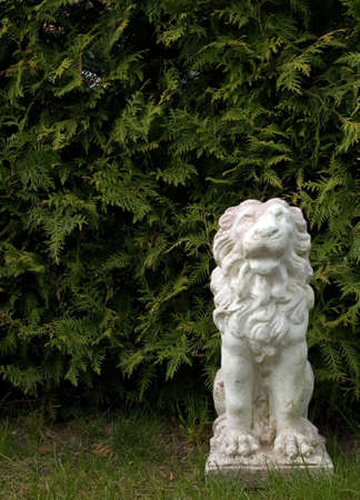 There is statue of lion in green backgroundの写真素材