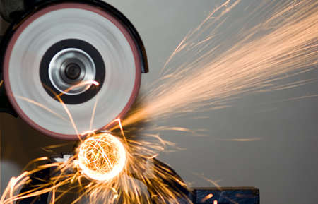 There is yellow sparking scintilla from metal