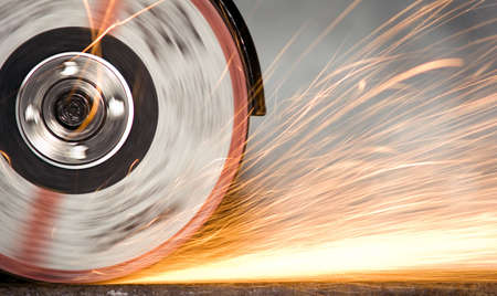 There is yellow sparking scintilla from metalの写真素材