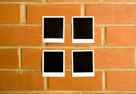 There are some pictures sticked on the wallの写真素材