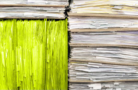Many documents with one block of another color, yellow