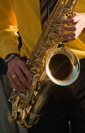 There is a man playing with saxophoneの写真素材