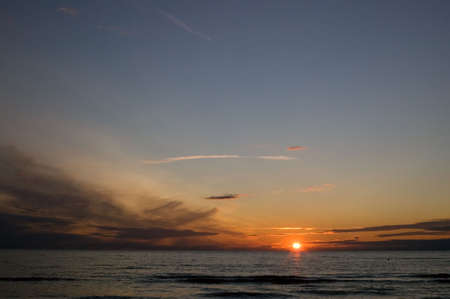 Sea and the sun over horizon, eveningの写真素材