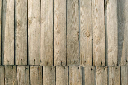 It is a brown wooden wall, background of vintage architectureの写真素材