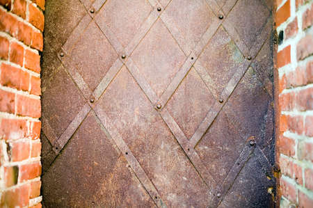 Rusty metal frame with red antique brick edgesの写真素材