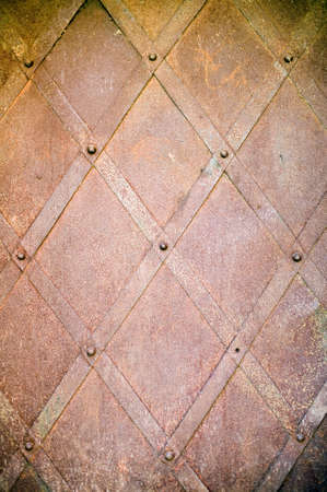 Rusty metal texture with lines and screwesの写真素材