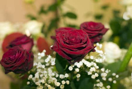 There is a beautiful bouquet from three red roses