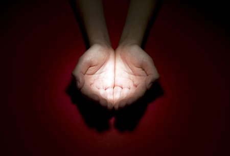 Child is holding figure in his handsの写真素材