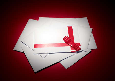 White envelope with red background for christmas cardsの写真素材