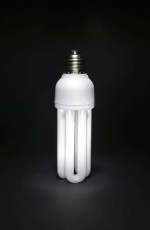 Electric bulb on black background with white light