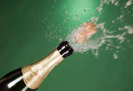 Explosion of green champagne bottle cork on backgroundの写真素材