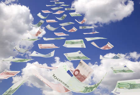 There are blue sky with clouds and euro moneyの写真素材