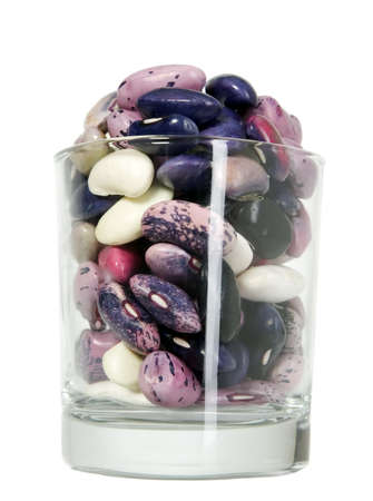 Various sizes and colors beans placed in a glassの写真素材