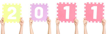 Child is holding number 2011, new year conceptの写真素材