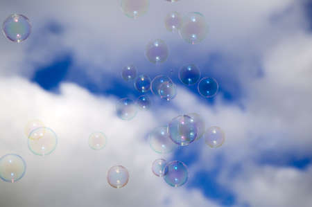 There are flying soap bubbles in sky