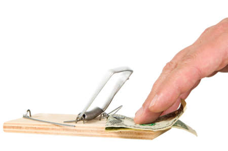 A mouse trap with money on itの写真素材