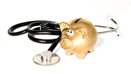 A black medicine stethoscope with golden money-boxの写真素材