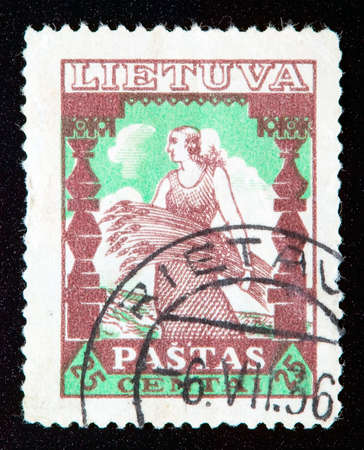LITHUANIA - CIRCA 1936: stamp printed by Lithuania and shows country live, circa 1936のeditorial素材