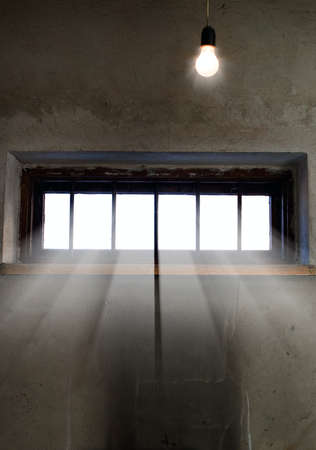 Light is coming through the barred window, hope conceptの写真素材
