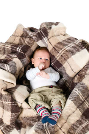 Baby boy is in the box with furry blanketの写真素材