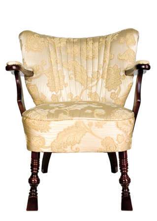 Yellow vintage chair with brown wooden legsの写真素材