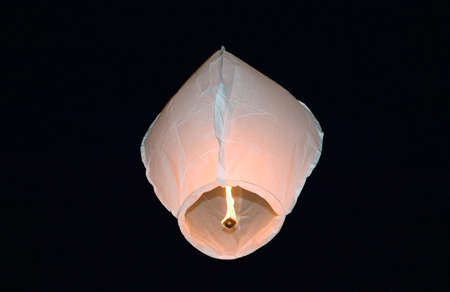 White fire balloon on the dark night backgroundの写真素材