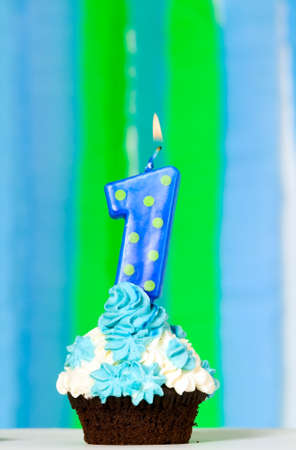 Small birthday cake with one candle on it