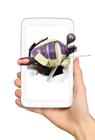 Man is holding smart mobile phone with industry tools on screenの写真素材