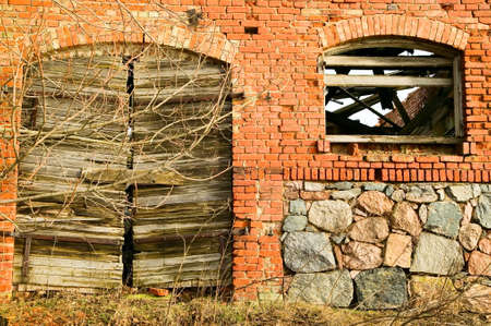 There is old vintage doors in ancient stone building