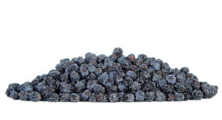 Dried black aronia berries on white backgroundの写真素材