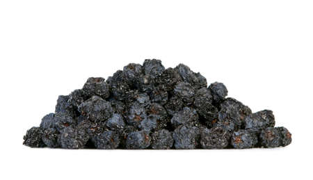 Dried black aronia berries on white backgroundの写真素材