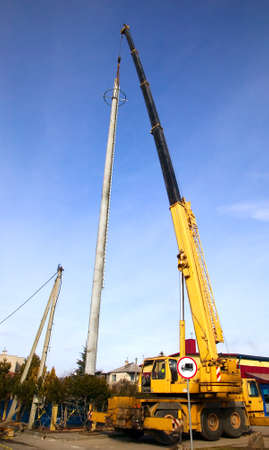 Crane is building communication antenna, heavy industryの写真素材