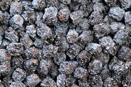 Texture of dried black aronia berries, food backgroundの写真素材