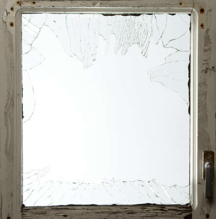Broken window glass with wooden vintage frame around
