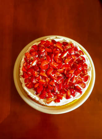cream and strawberry cake with lemon sponge cakeの写真素材