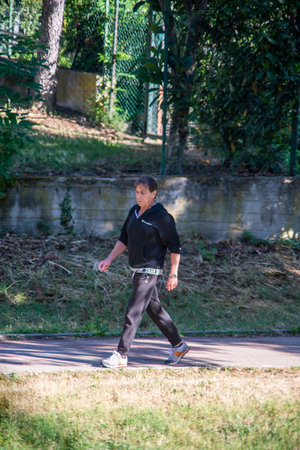 terni,italy may 31 2020 : woman doing physical activity at park in the morningのeditorial素材