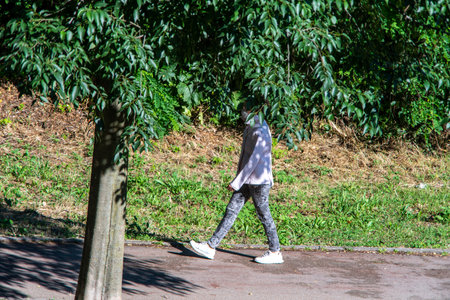 terni,italy may 31 2020 : woman doing physical activity at park in the morningのeditorial素材
