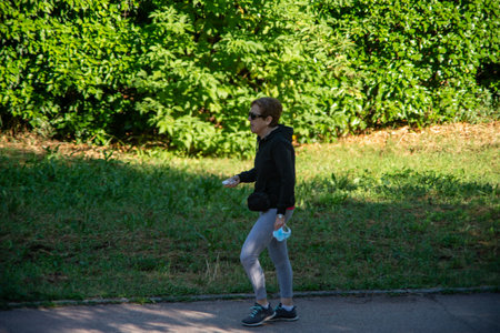 terni,italy may 31 2020 :woman doing physical activity at park in the morningのeditorial素材