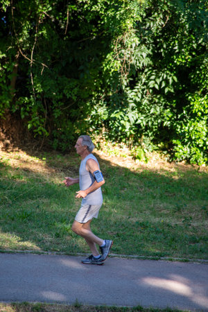 terni,italy june 01 2020 :man doing physical activity at park in the morningのeditorial素材