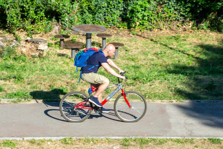 terni,italy june 01 2020 :boy on a bicycle at the morning prcoのeditorial素材