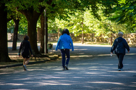 terni,italy june 01 2020 :people walking spaced out in the park for covid emergencyのeditorial素材