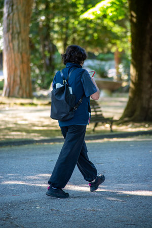 terni,italy june 01 2020 :girl walking at park in the morningのeditorial素材