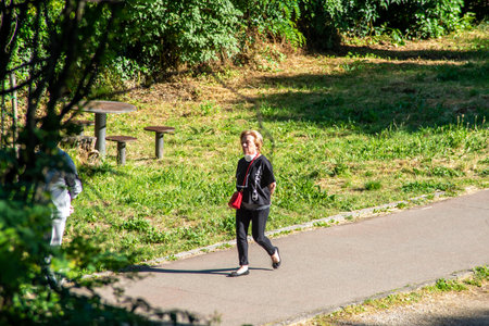 terni,italy june 01 2020 :woman strolling in the park in the morningのeditorial素材