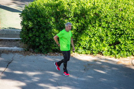 terni,italy june 01 2020 :man doing physical activity at park in the morningのeditorial素材