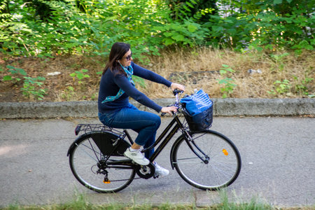 terni,italy june 01 2020 :woman cycling at park in the morningのeditorial素材