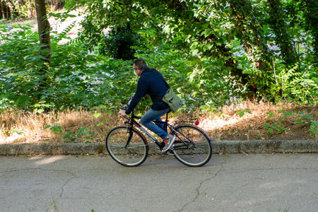 terni,italy june 01 2020 :boy cycling at park in the morningのeditorial素材