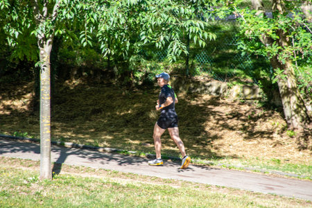 terni,italy june 01 2020 :man doing physical activity at park in the morningのeditorial素材